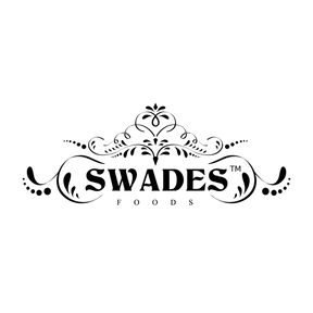 The black and white logo for Swades Foods, featuring an ornate decorative crest above the brand name in a bold serif font, with 'FOODS' written in smaller capital letters underneath, all on a solid white background.