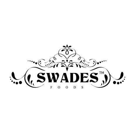 The black and white logo for Swades Foods, featuring an ornate decorative crest above the brand name in a bold serif font, with 'FOODS' written in smaller capital letters underneath, all on a solid white background.